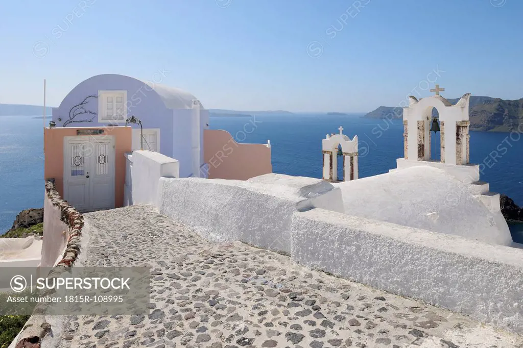 Greece, View of Oia village with bell tower of Greek Orthodox Church at Santorini