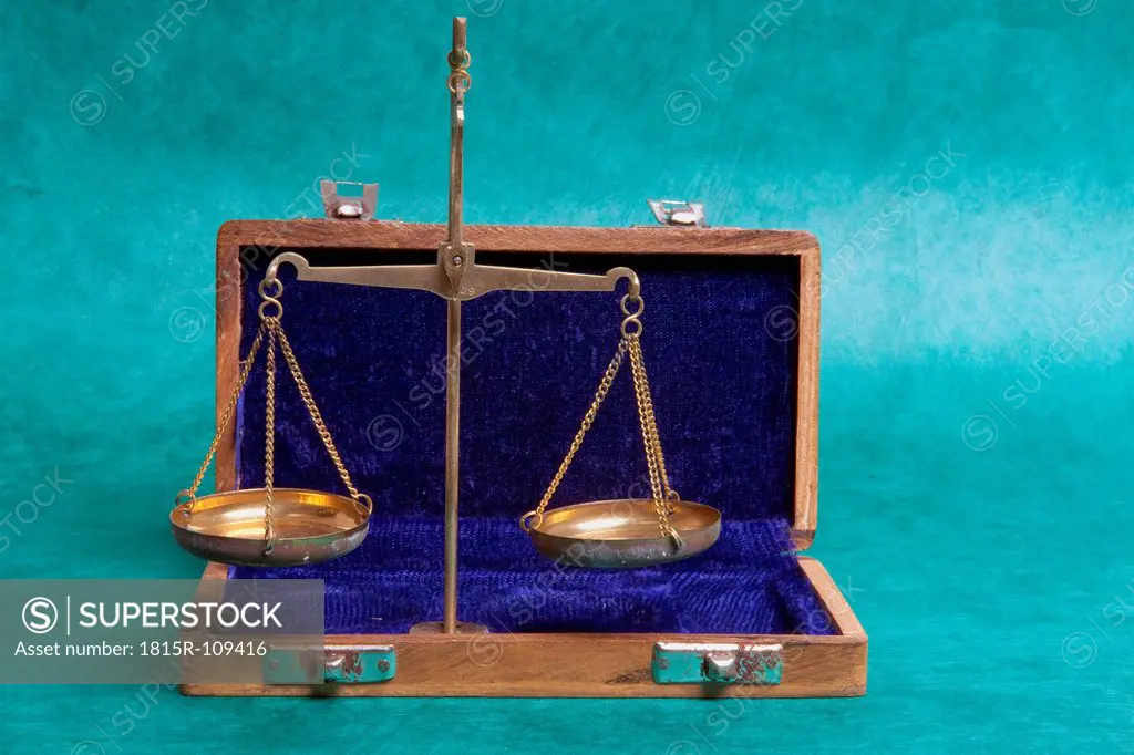 Pharmacy scale with brief case on green background