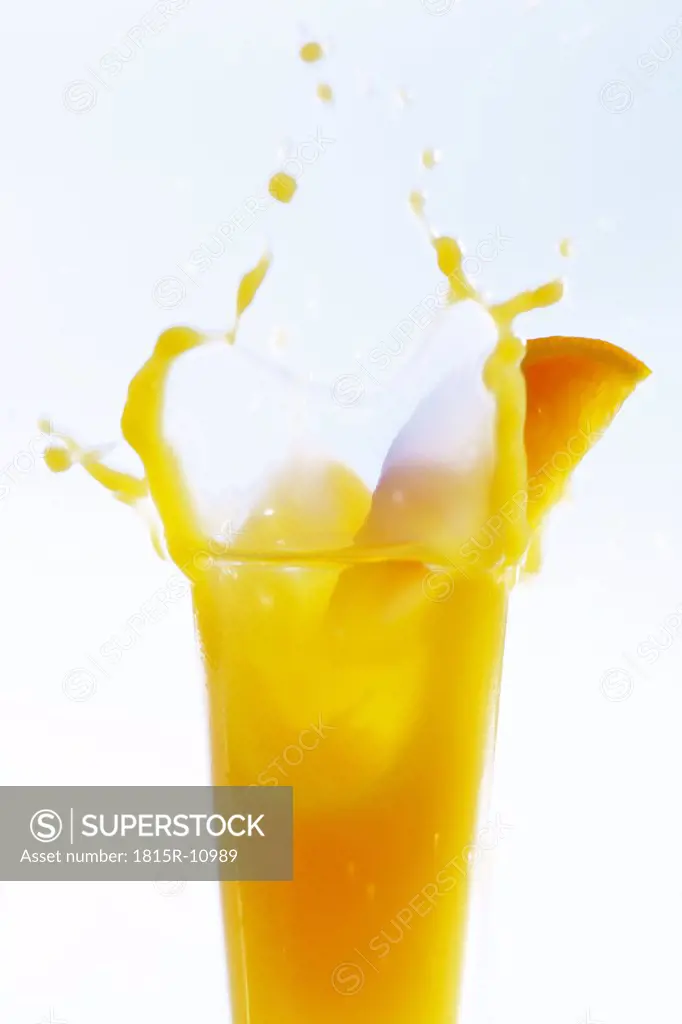 Orange juice splashing, close-up