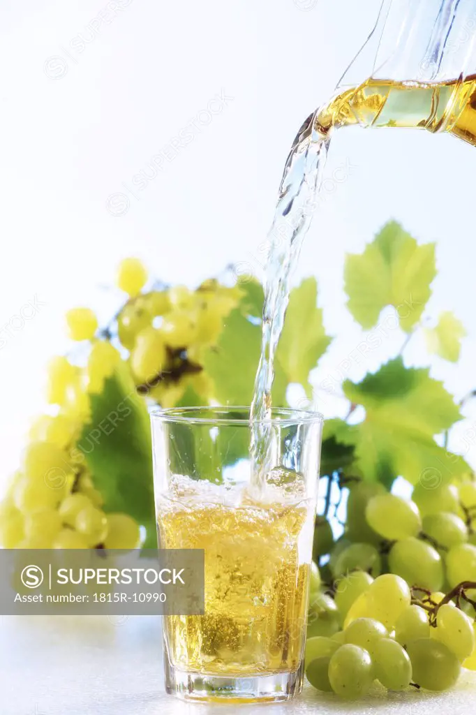 Grape juice been poured into glass