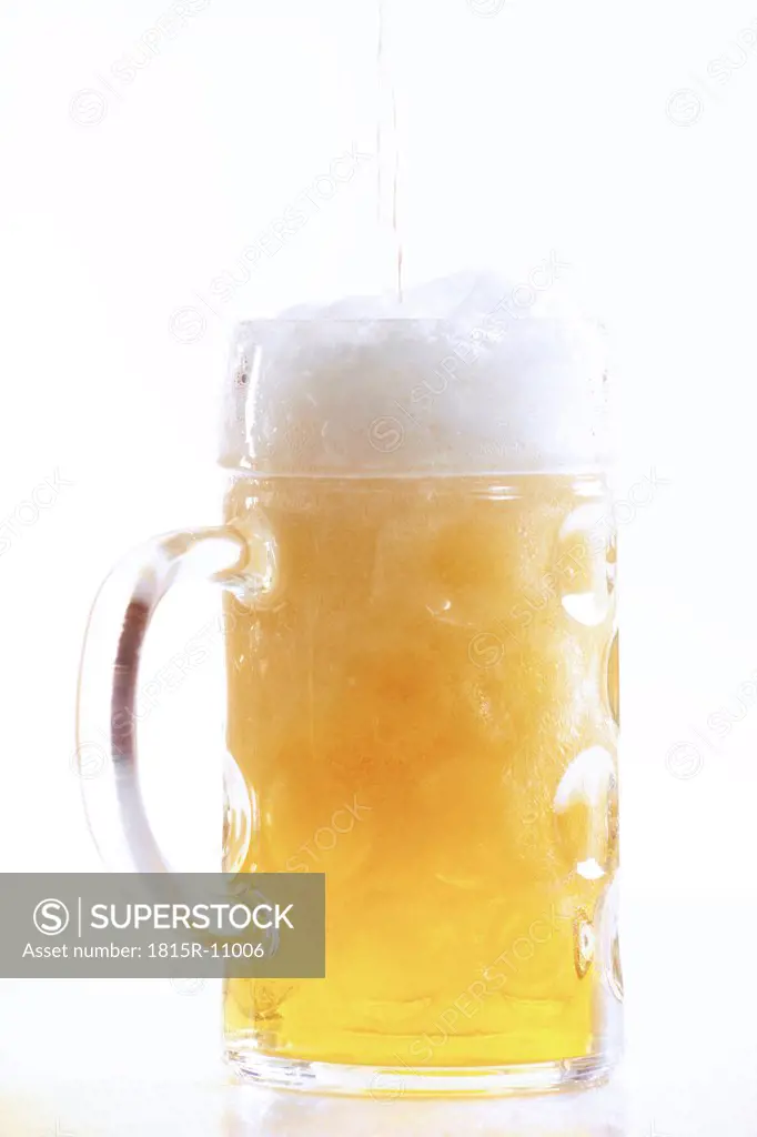 Pouring beer into glass, close-up