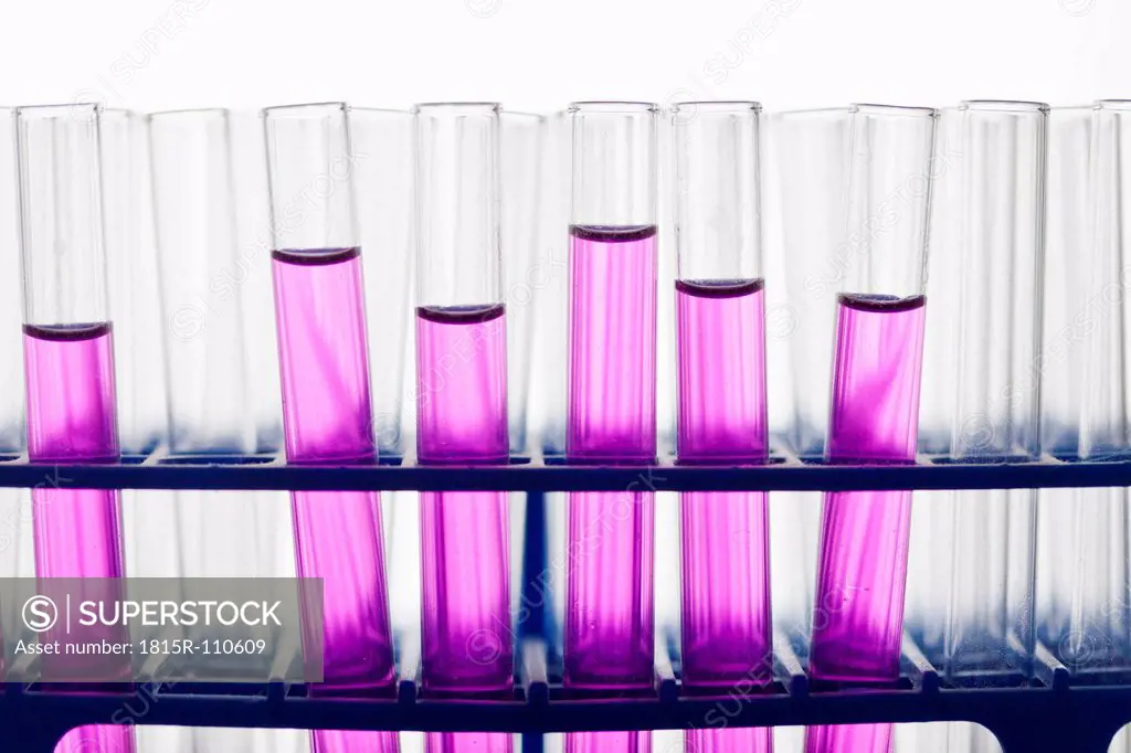 Test tubes with pink solution, close up