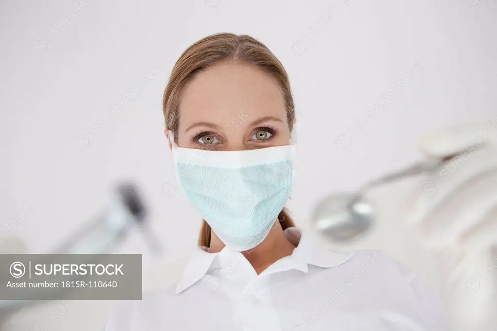 Germany, Close up of dentist with surgical mask
