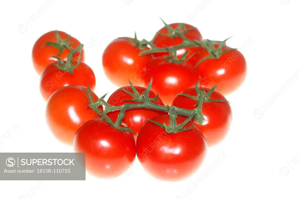 Close up of red tomatoes on white background