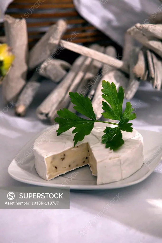 Plate of camembert cheese with parsley