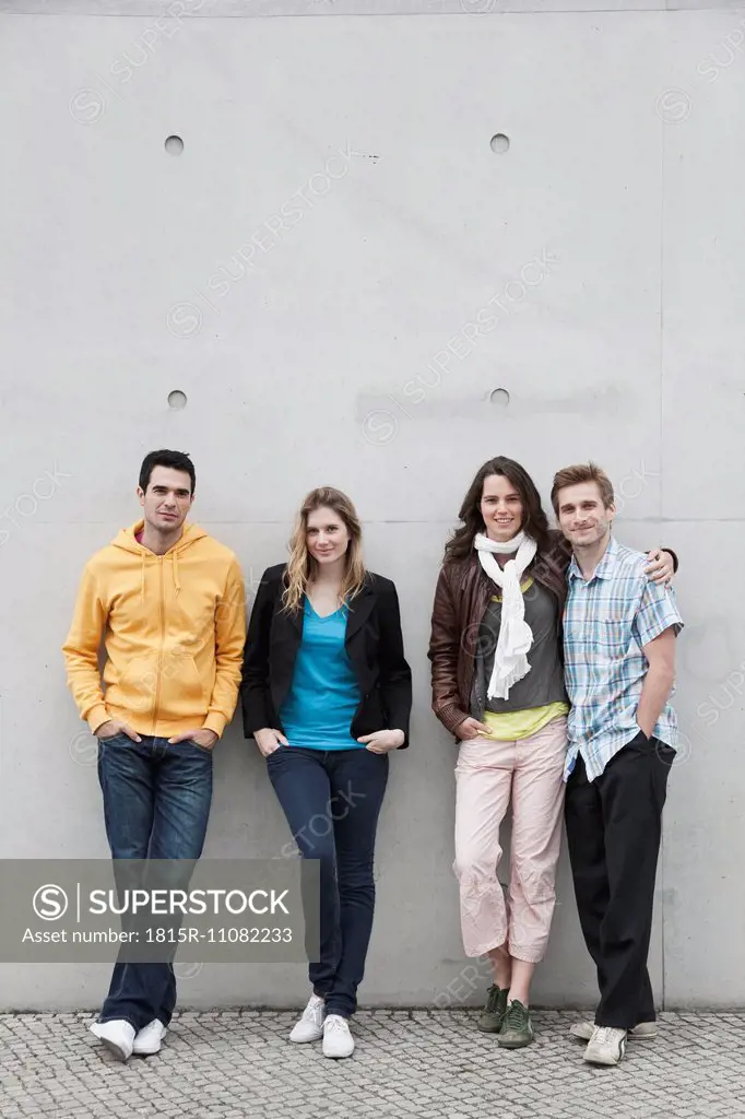 Germany, Berlin, Man and woman standing against wall, portrait