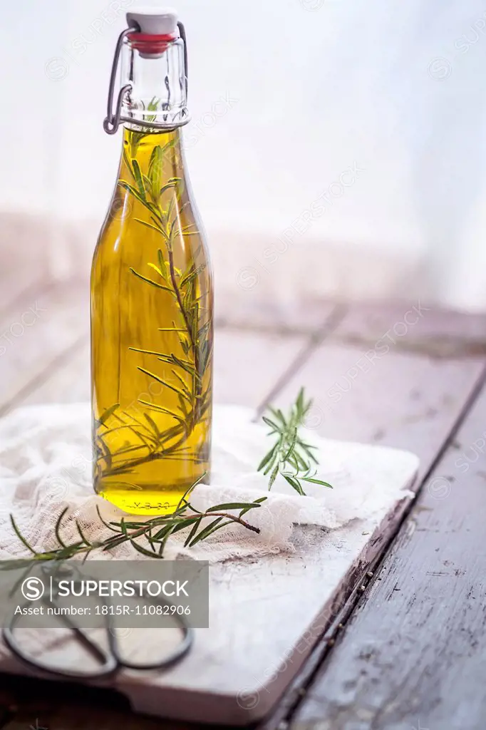 Rosemary oil, rosemary twig in olive oil