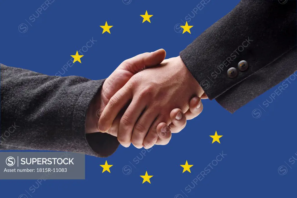 Men shaking hands against European union flag