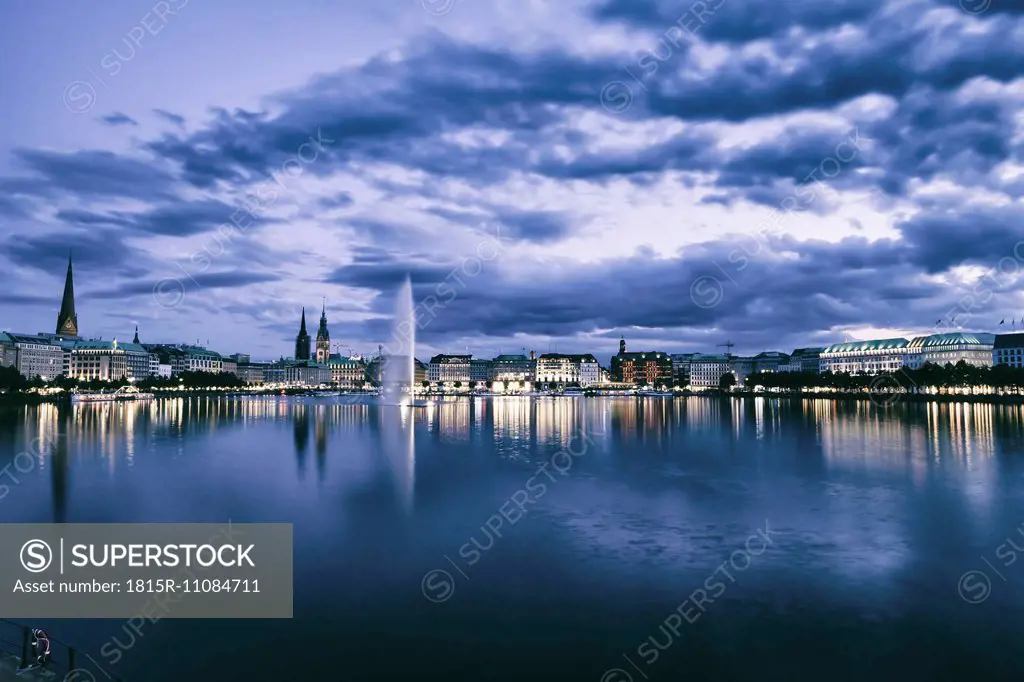 Germany, Hamburg, Inner Alster and Alster fountain in the evening