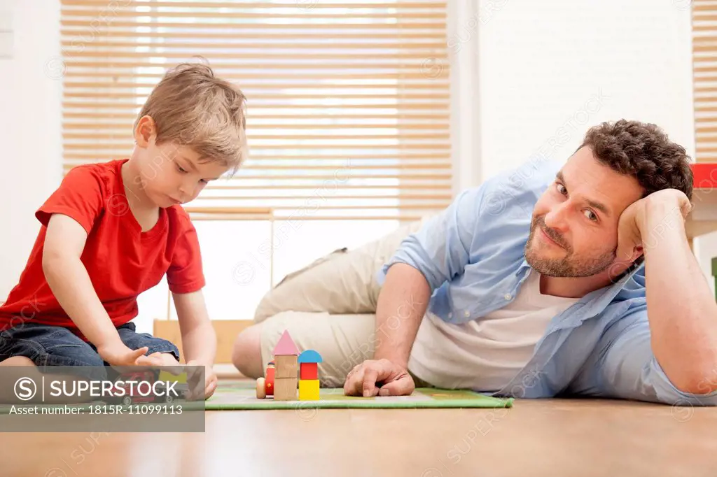 Father and son playing together in the nursery