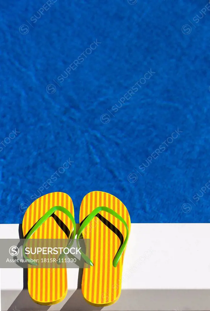 Austria, Linz, Striped flip flop sandles at swimming pool