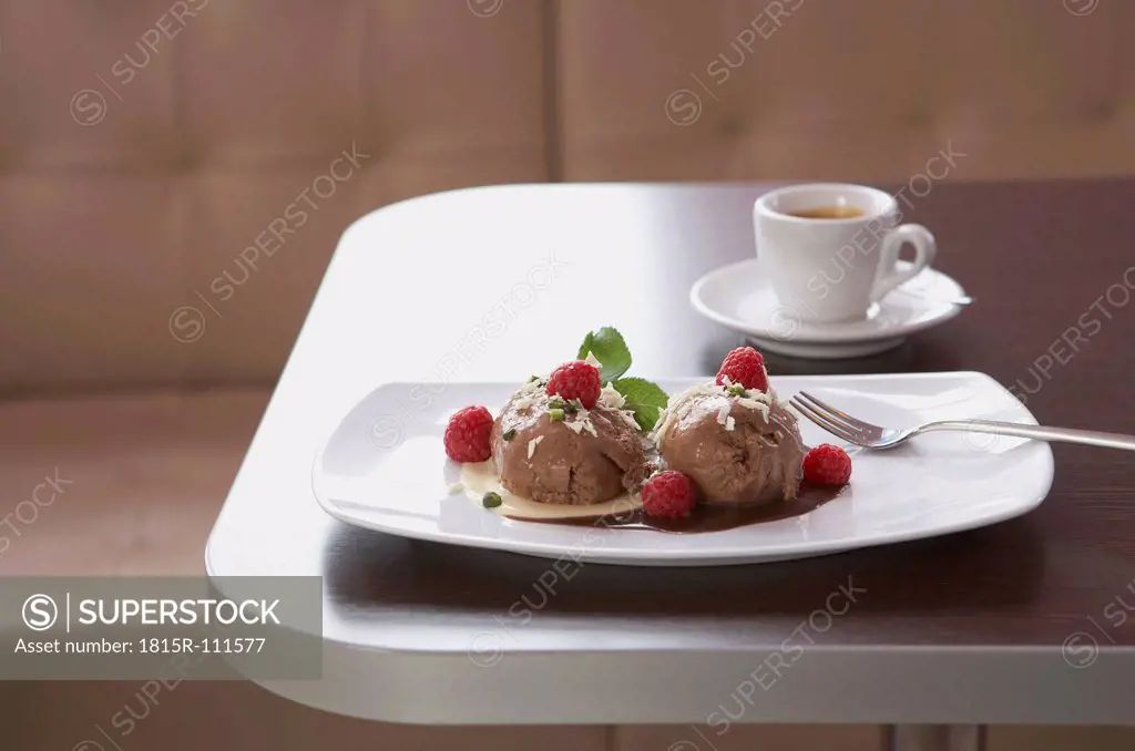 Chocolate icecream with raspberry, espresso in background