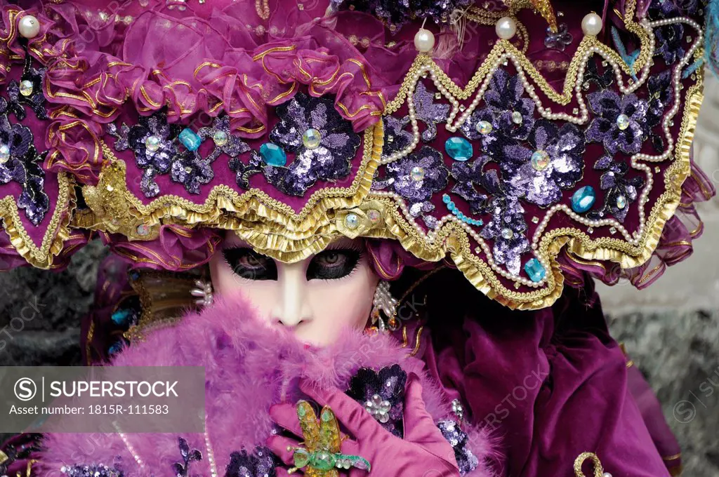 Woman with Venetian mask and costume