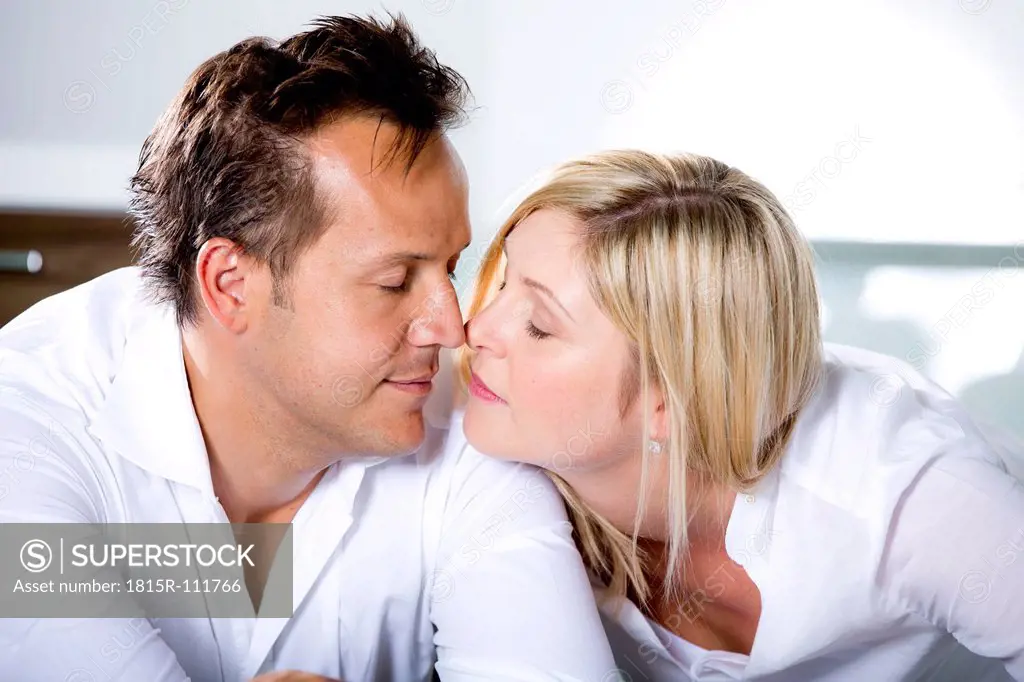 Germany, Mid adult couple touching nose