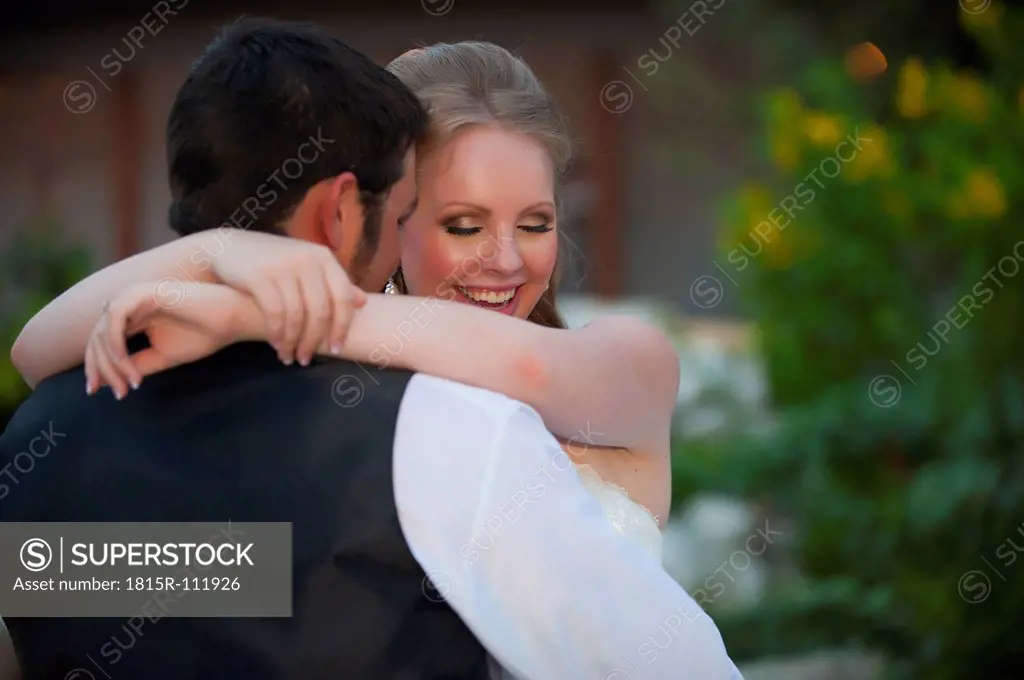 USA, Texas, Bride and groom romancing, close up