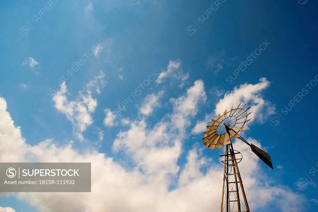 USA, Texas, Ranch windmill with water well pump against sky