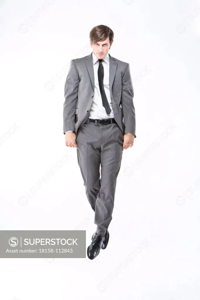 Portrait of businessmanagainst white background, close up