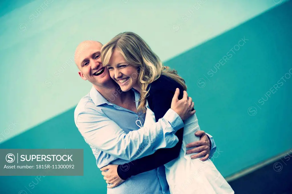Portrait of young couple hugging