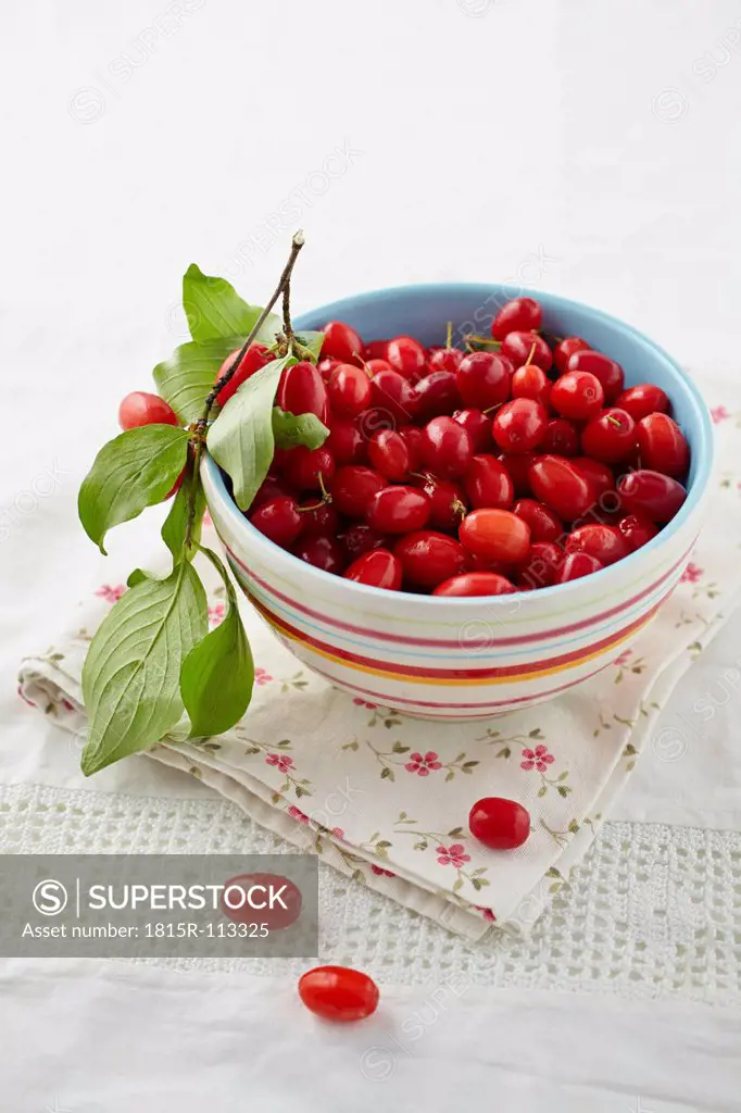Cornel cherries in bowl on table