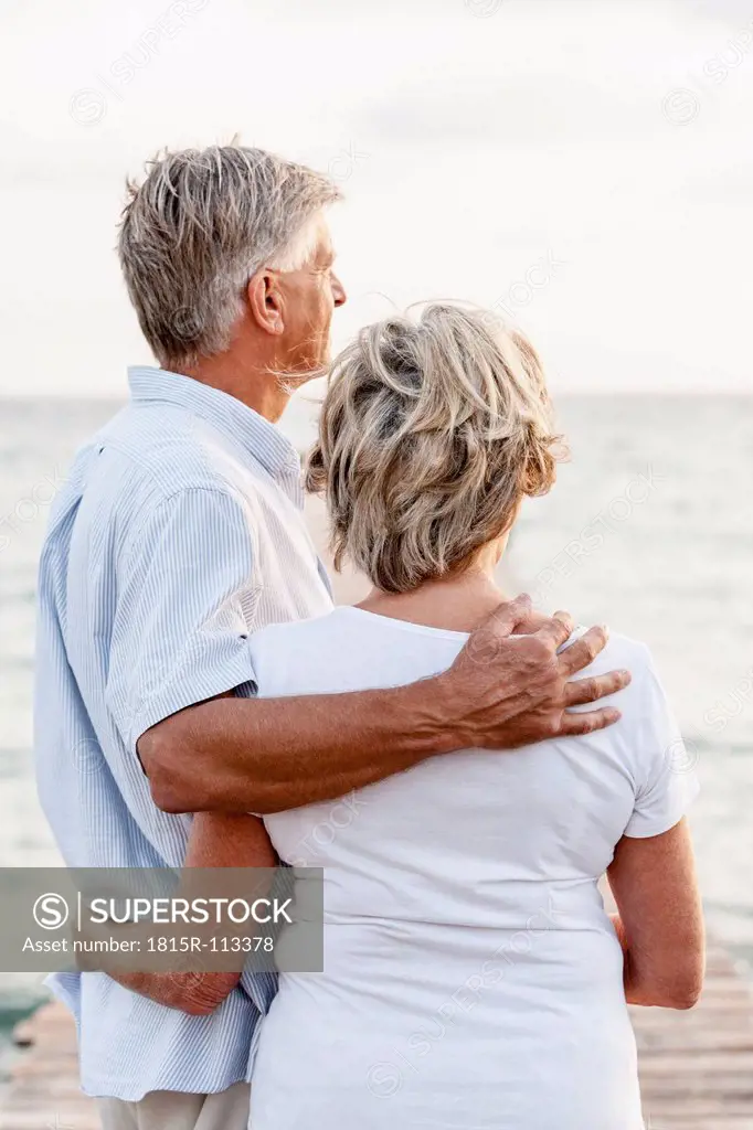 Spain, Senior couple standing at the sea