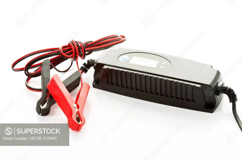 Car battery with charger on white background