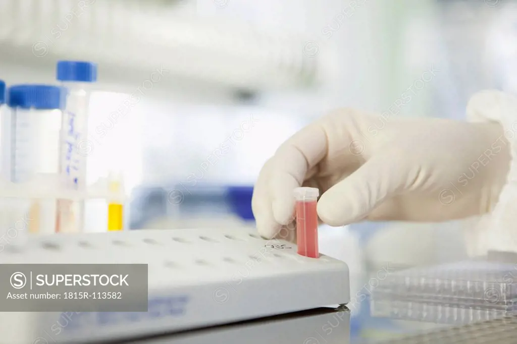 Germany, Bavaria, Munich, Scientist researching blood in laboratory