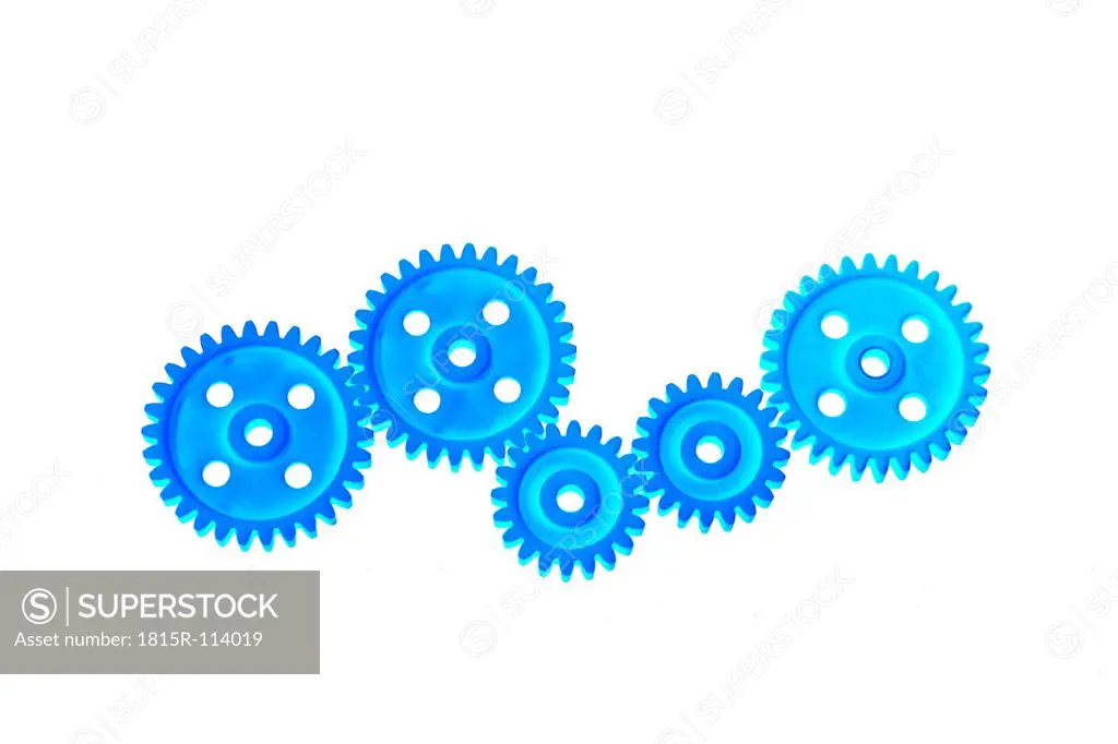 Close up of plastic gear wheels on white background
