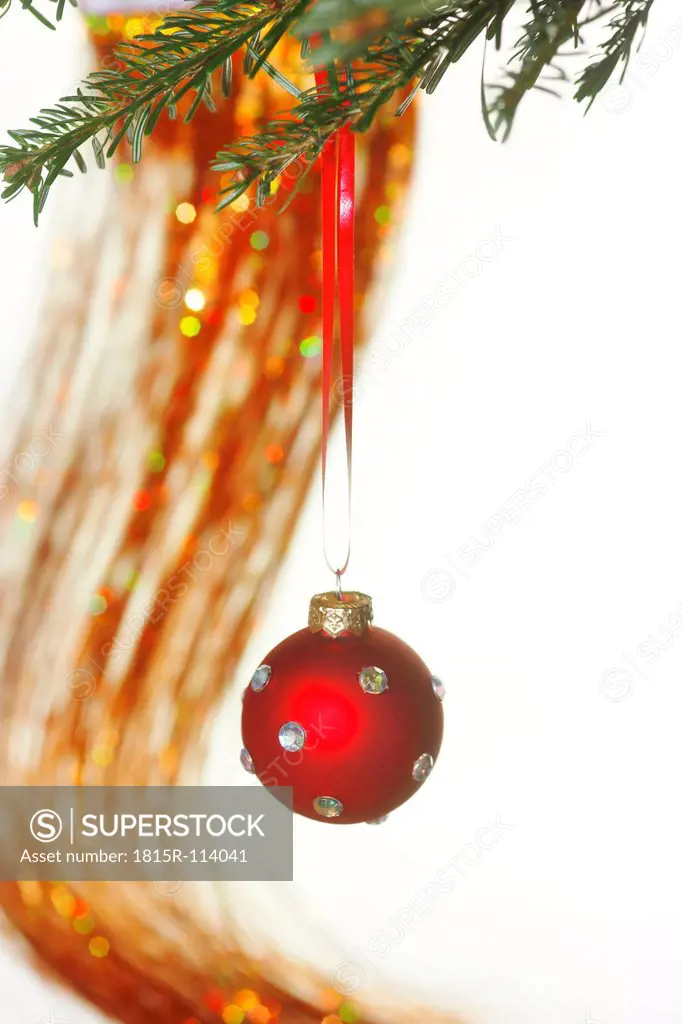 Germany, Christmas bauble hanging to tree, close up