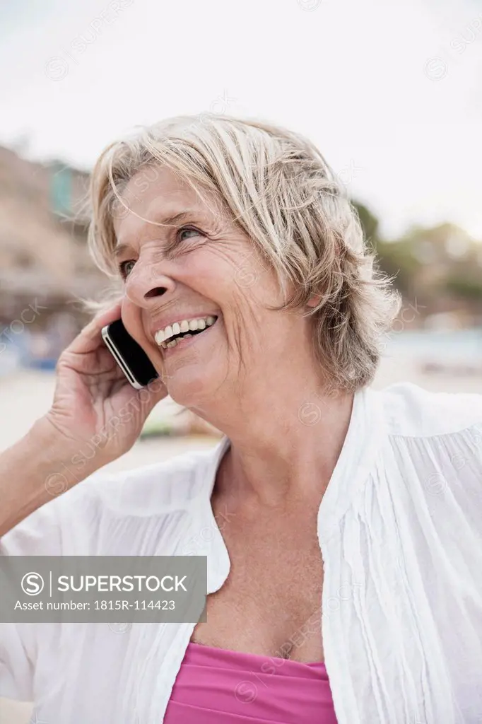 Spain, Senior woman talking on mobile phone