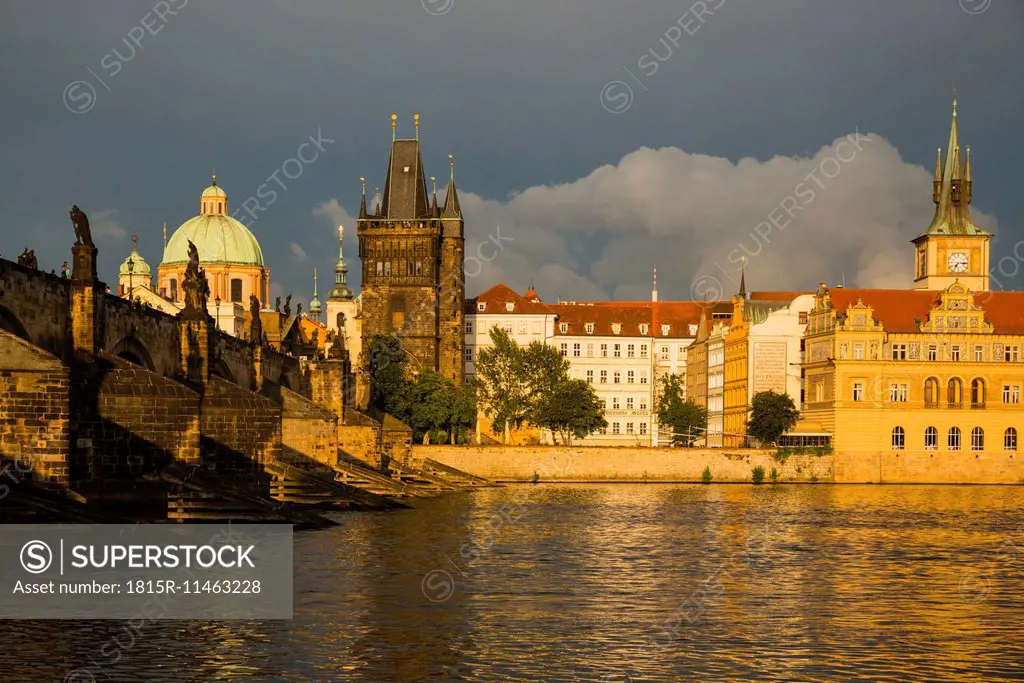 Czechia, Prague, Charles Bridge, Old Town Bridge Tower and Bedrich Smetana Museum in the evening