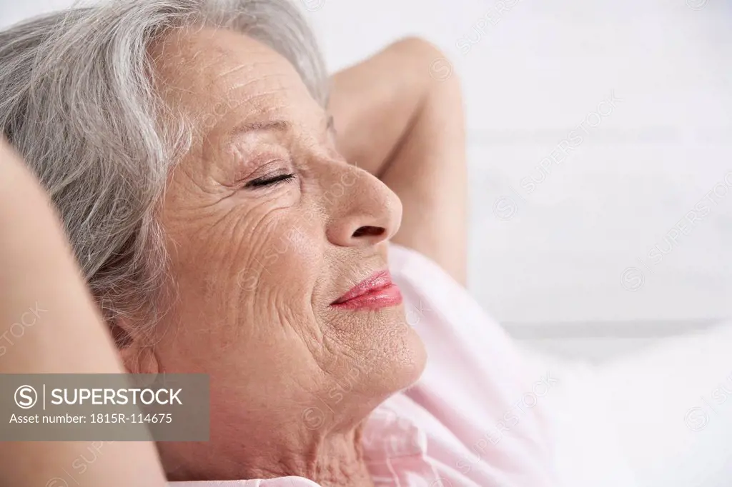 Spain, Senior woman relaxing, smiling