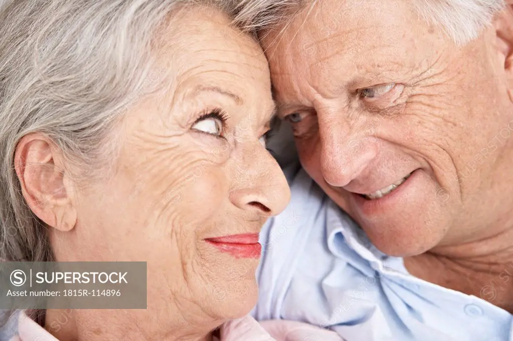 Spain, Senior couple looking at each other, smiling