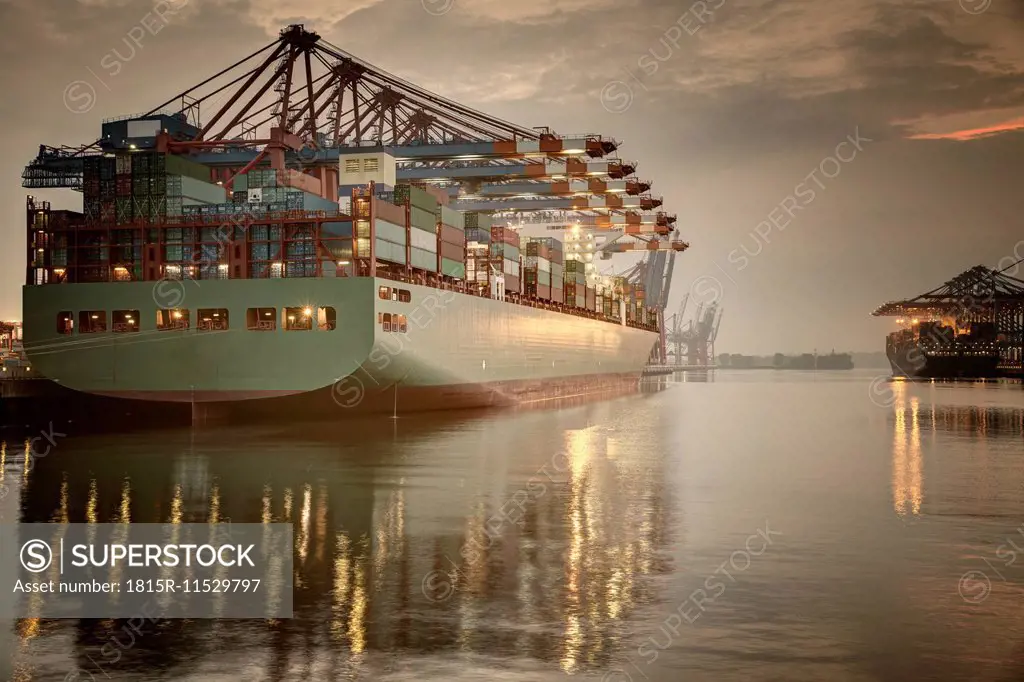 Germany, Hamburg, Container Terminal, Container ship in the evening