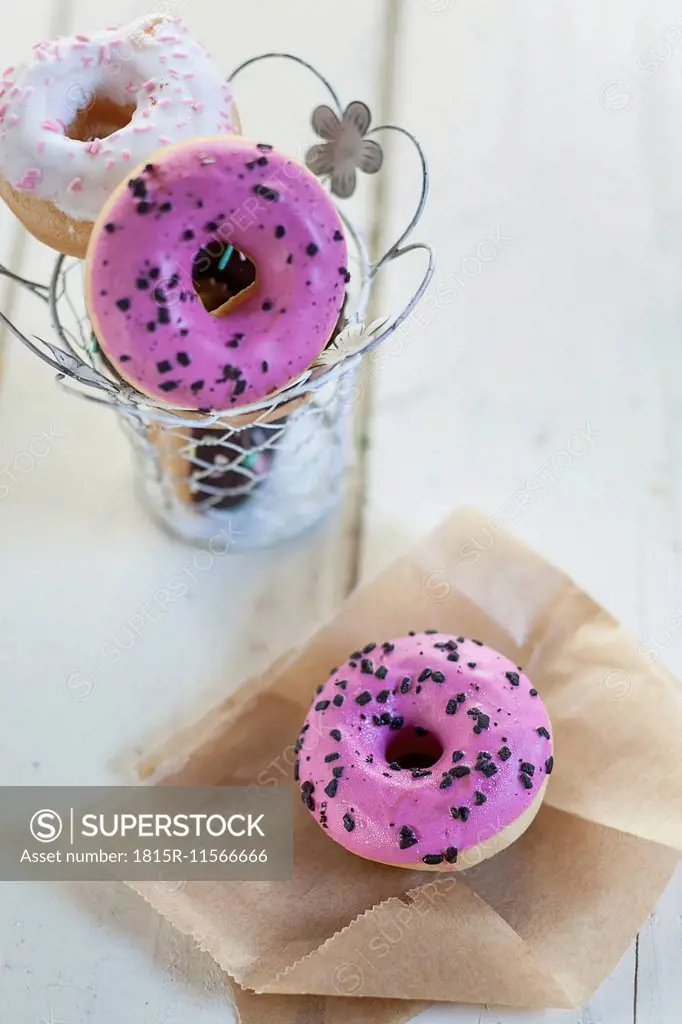 Pink and white donuts with chocolate sprinkles