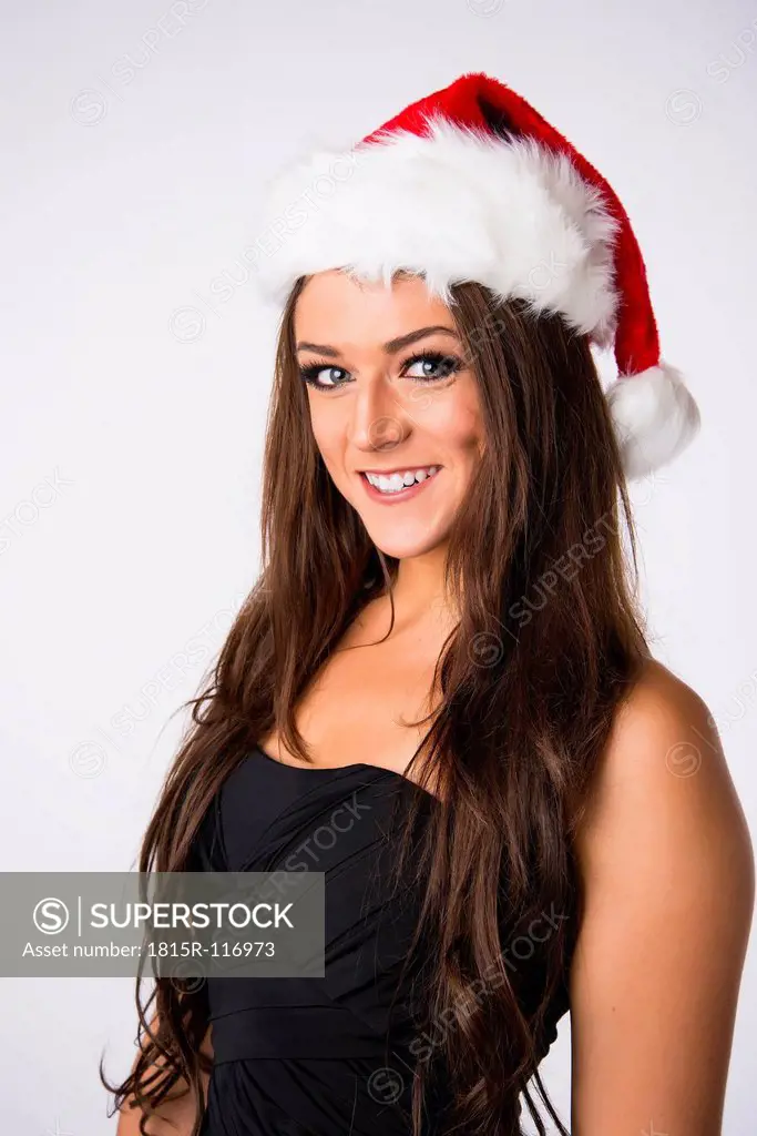 Young woman with Christmas cap, smiling, portrait