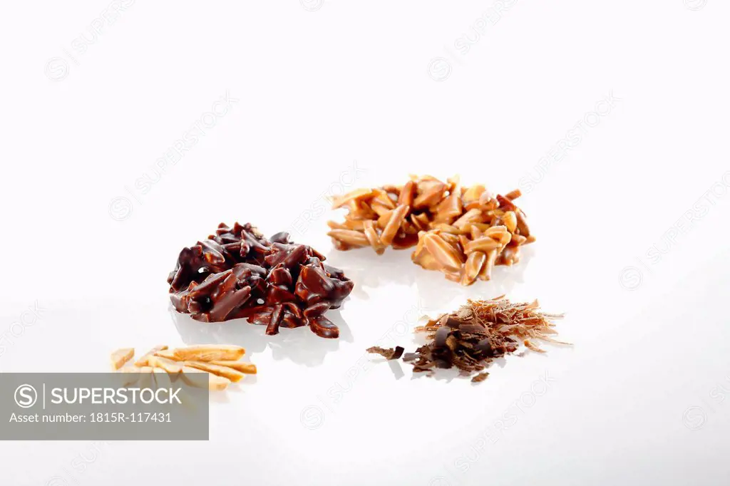 Variety of chocolate with almond pieces on white background