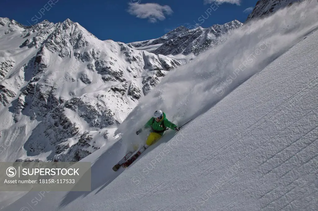 Austria, Tirol, Mid adult man doing freeride skiing