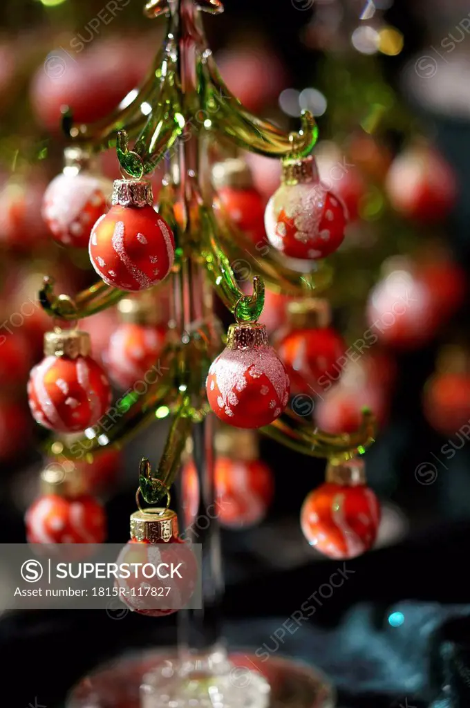 Germany, Small glass christmas tree with christmas baubles, close up