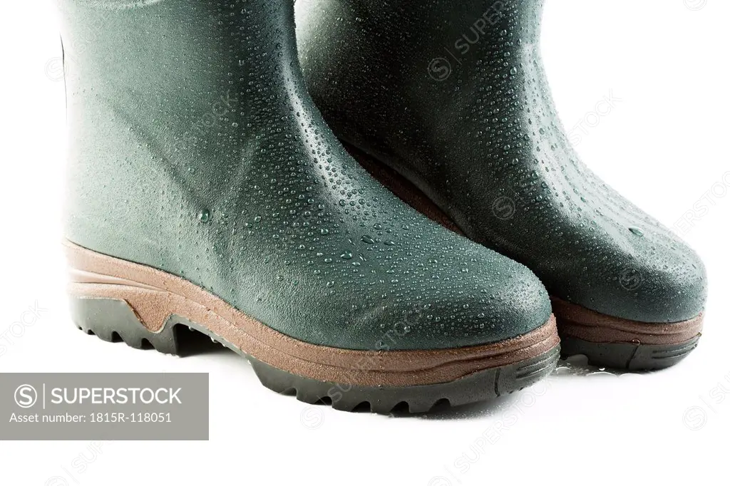 Close up of rubber boots on white background