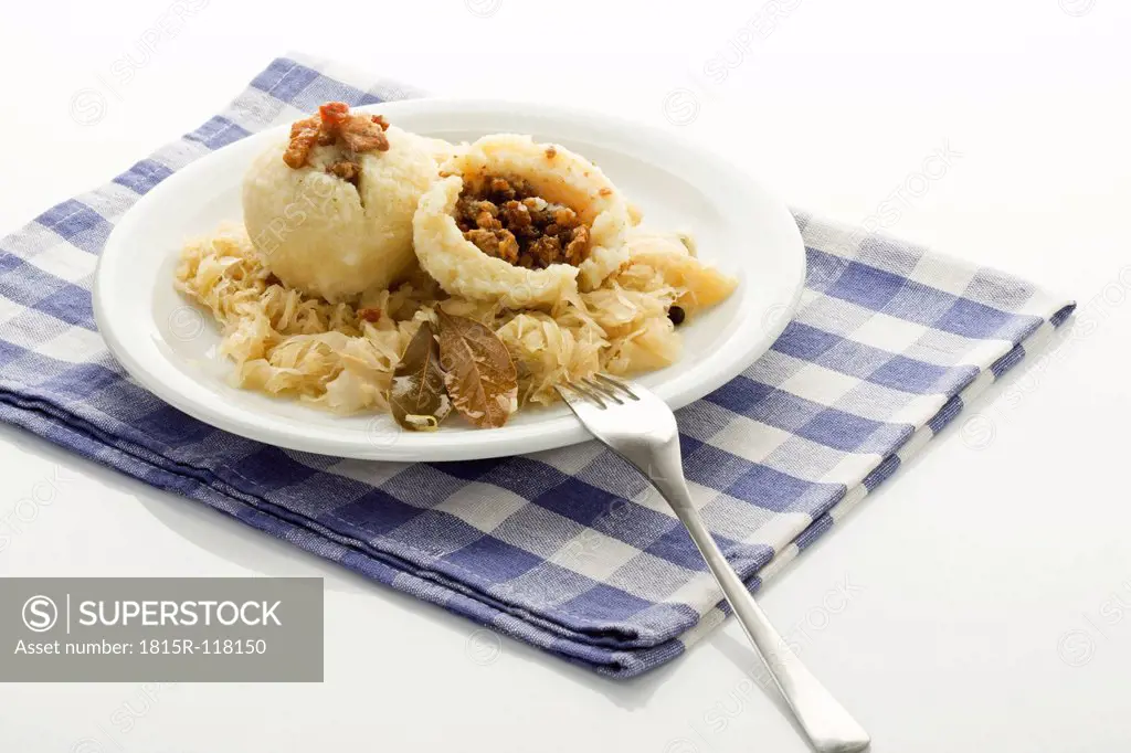 Greaves dumpling with sauerkraut on plate, close up