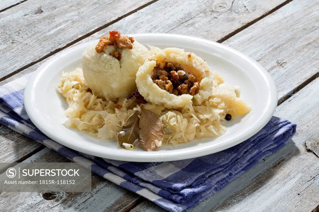 Greaves dumpling with sauerkraut on plate, close up