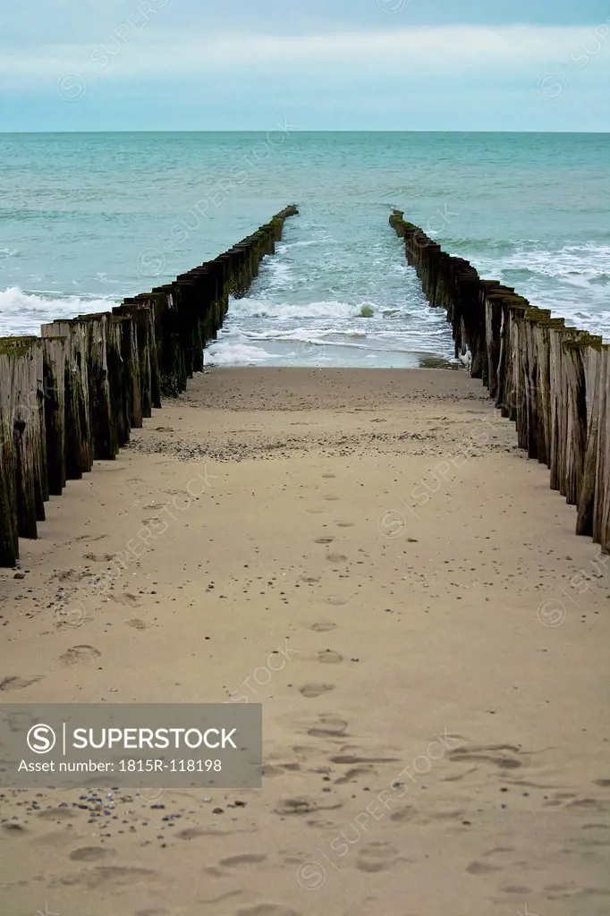 Netherlands, Zeeland, View of North Sea Beach with wood pillar