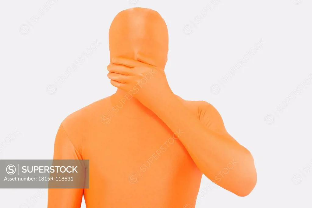 Mature man in orange zentai with hand over mouth