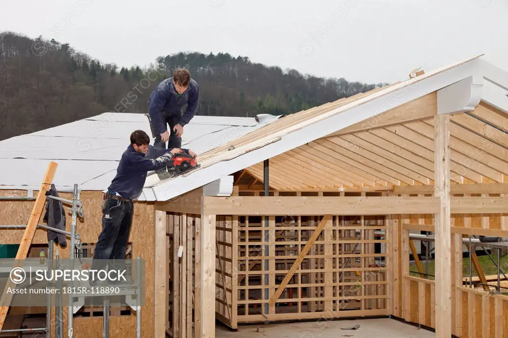 Europe, Germany, Rhineland Palatinate, Workers roofing on house