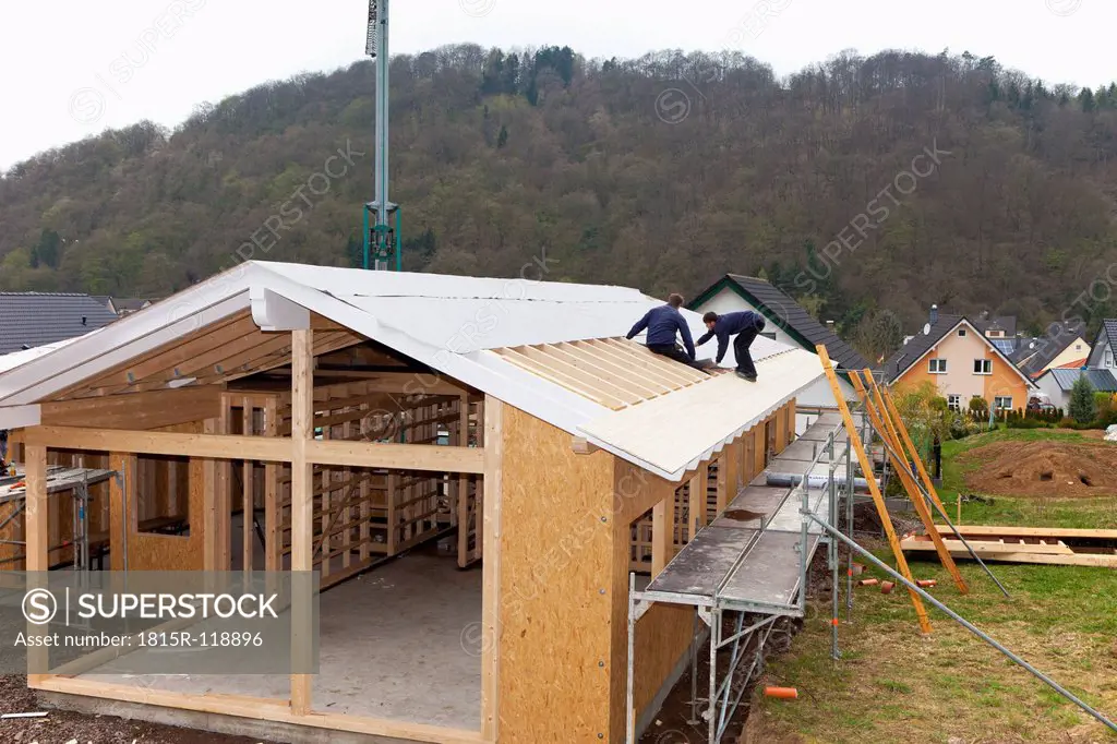 Europe, Germany, Rhineland Palatinate, Workers roofing on house