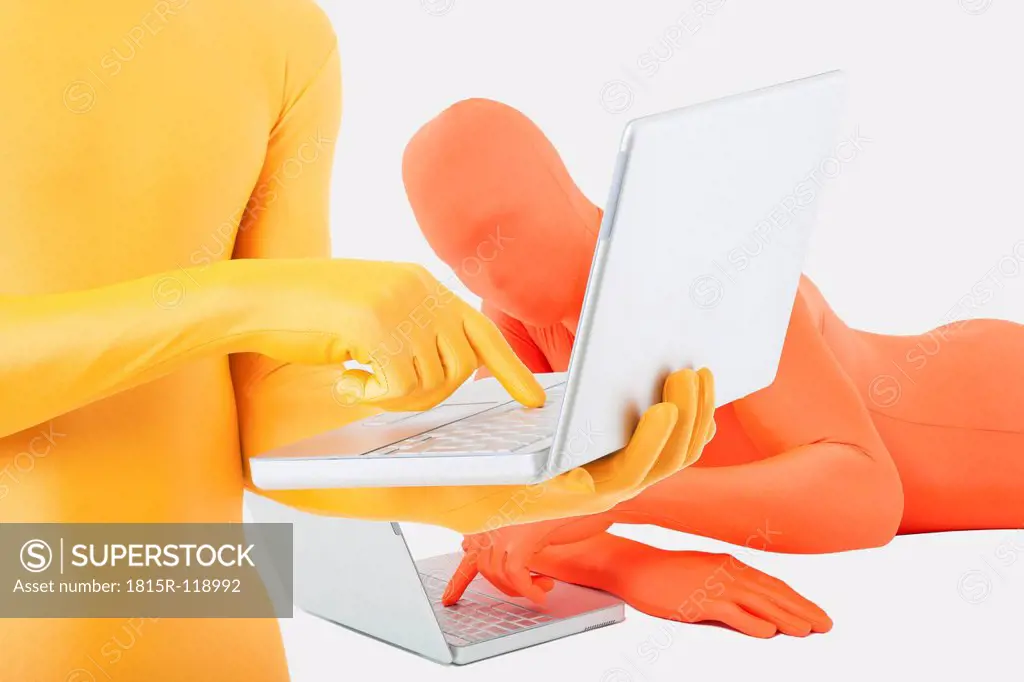 Men in yellow and orange zentai using laptop