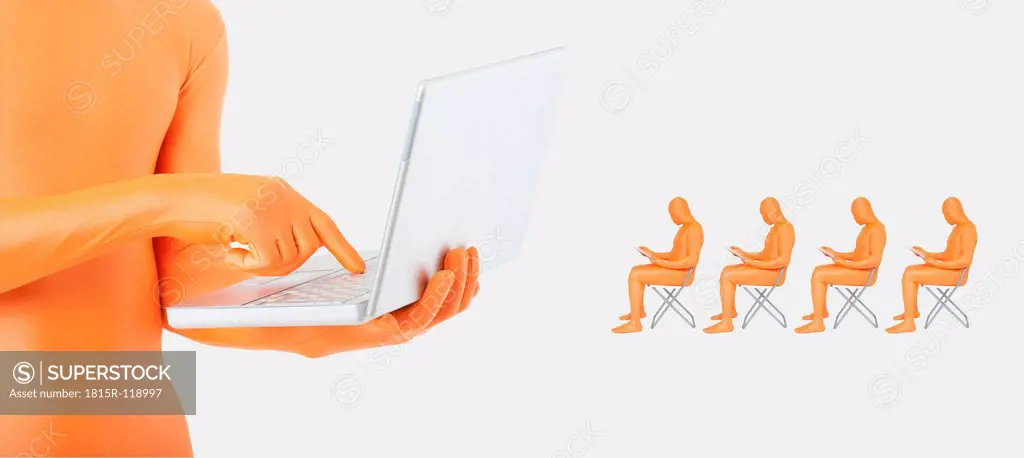 Man using laptop while another men using digital tablet on chair