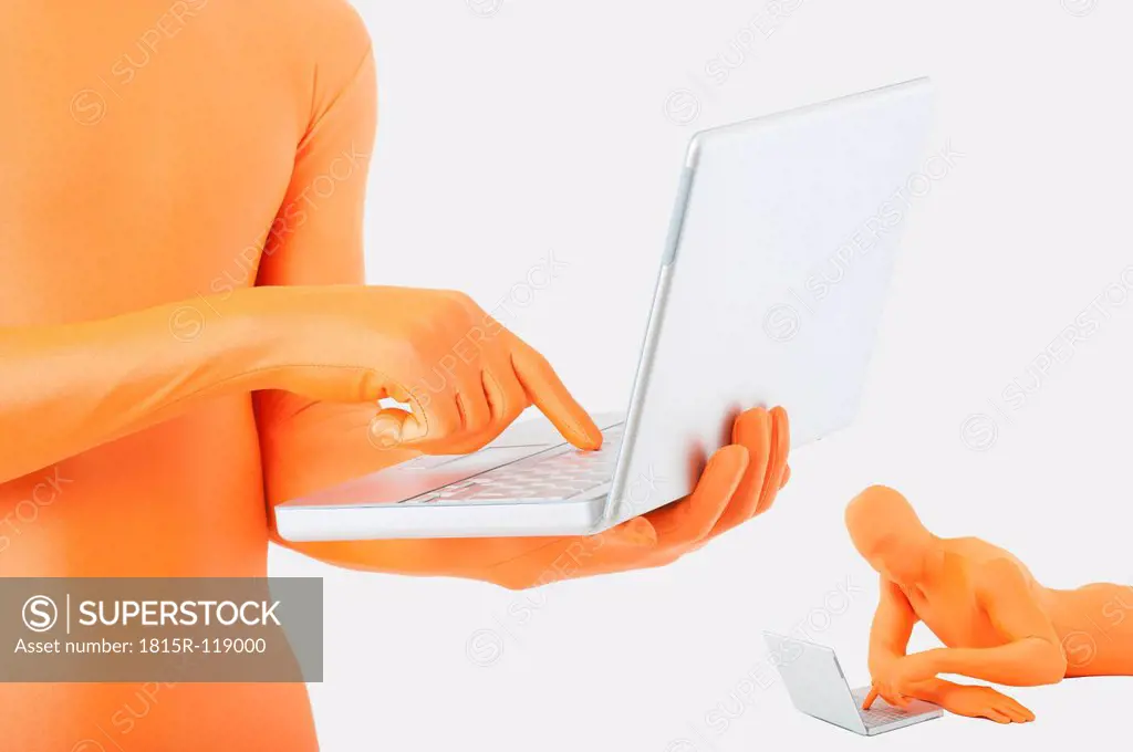 Men in orange zentai using laptop