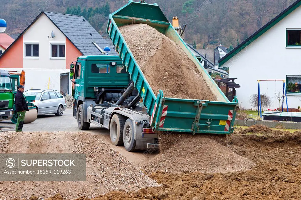 Europe, Germany, Rhineland Palatinate, Truck unloading crushed stone