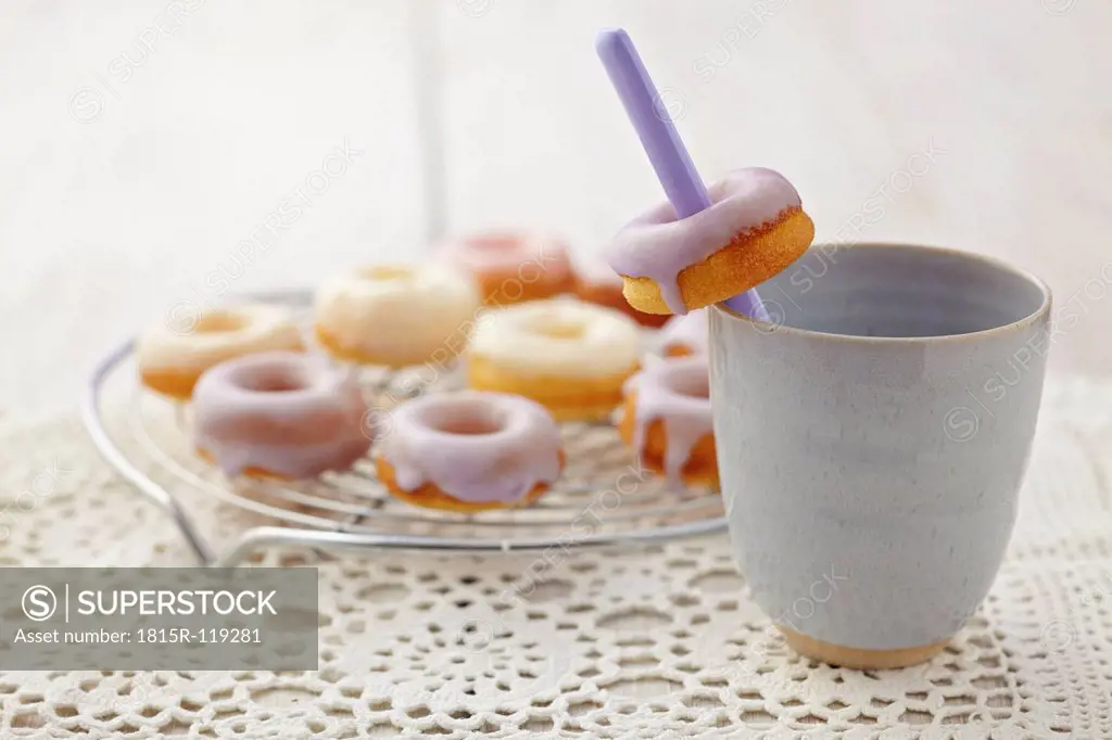 Glazed baked doughnuts on table